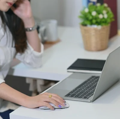 struggling clinic owner on her laptop