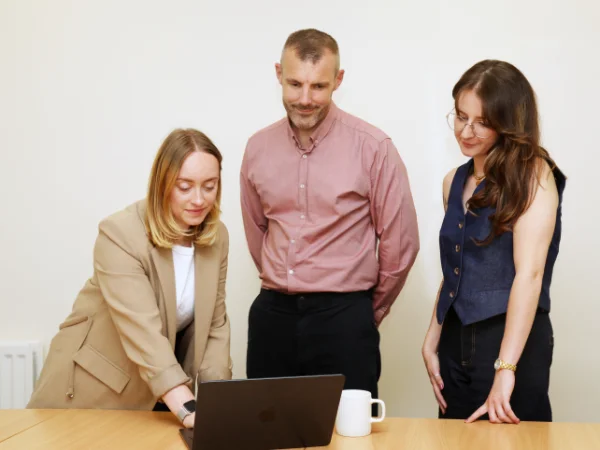 My Aesthetics Business team members reviewing a laptop
